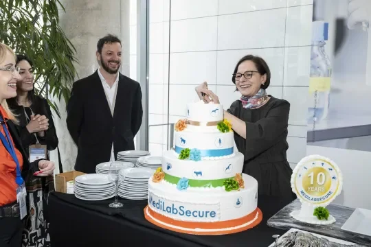 Prof. Yasmine Belkaid cutting the MediLabSecure 10 years cake 